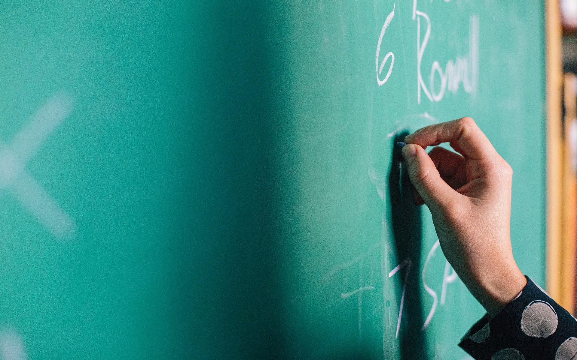 Person Writing on a Whiteboard